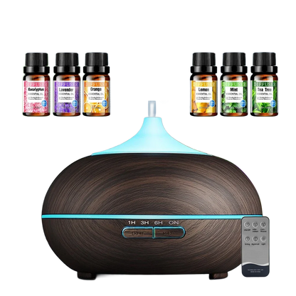 Ultrasonic aromatherapy diffuser with 6 essential oils set on clean white background